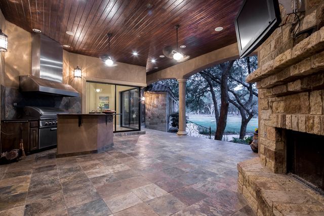 There is a fireplace in the middle of the room