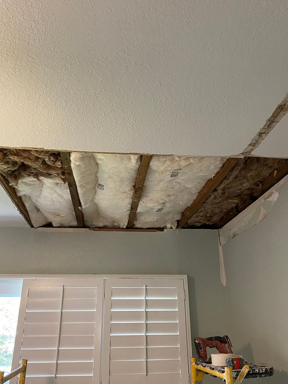 A room with a ceiling that is being remodeled