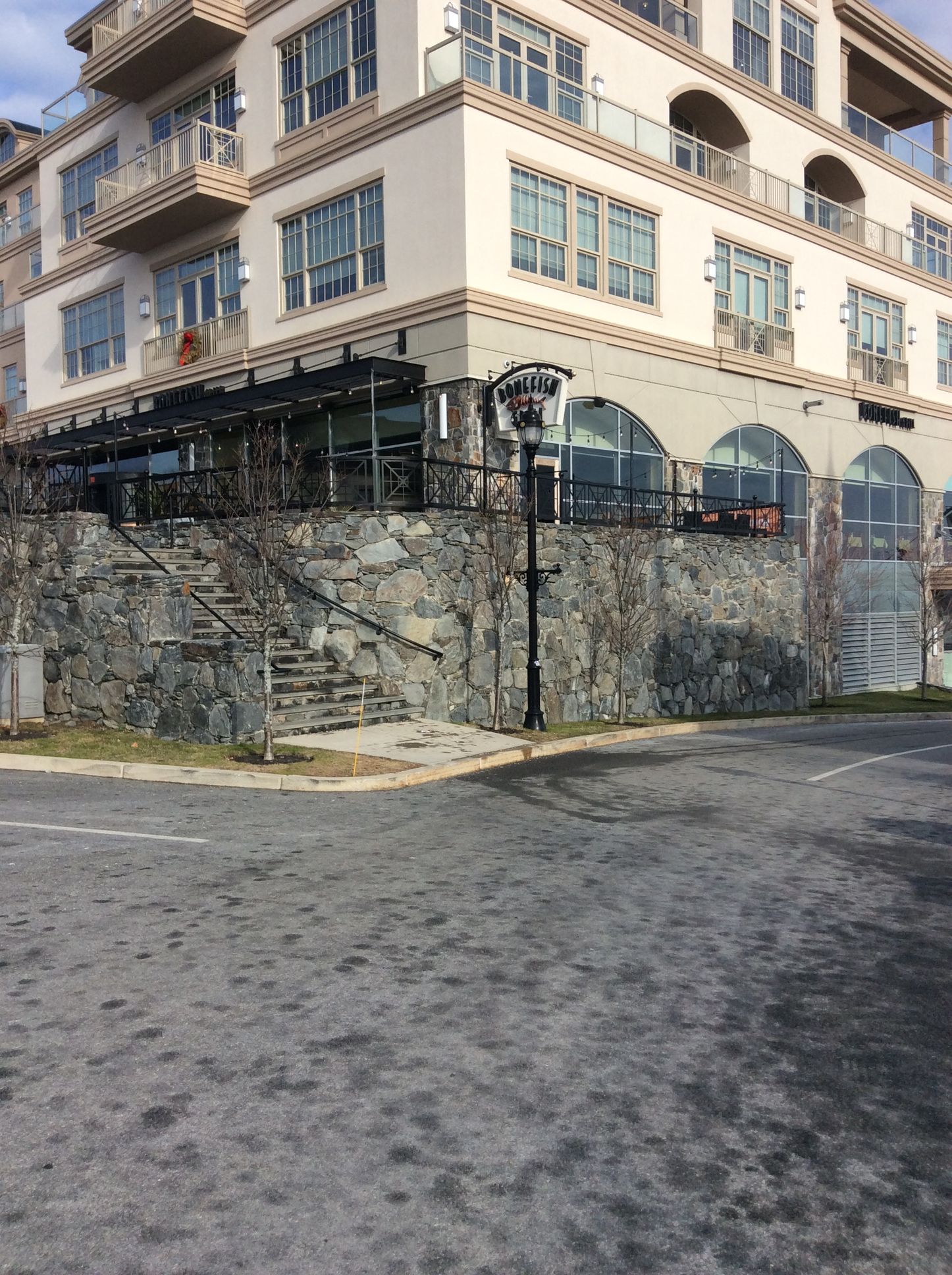 a large building with a lot of windows is sitting on top of a hill