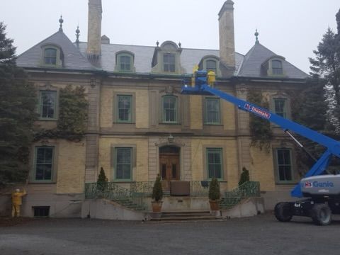 a large building with a crane in front of it