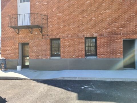 a brick building with a balcony on the side of it