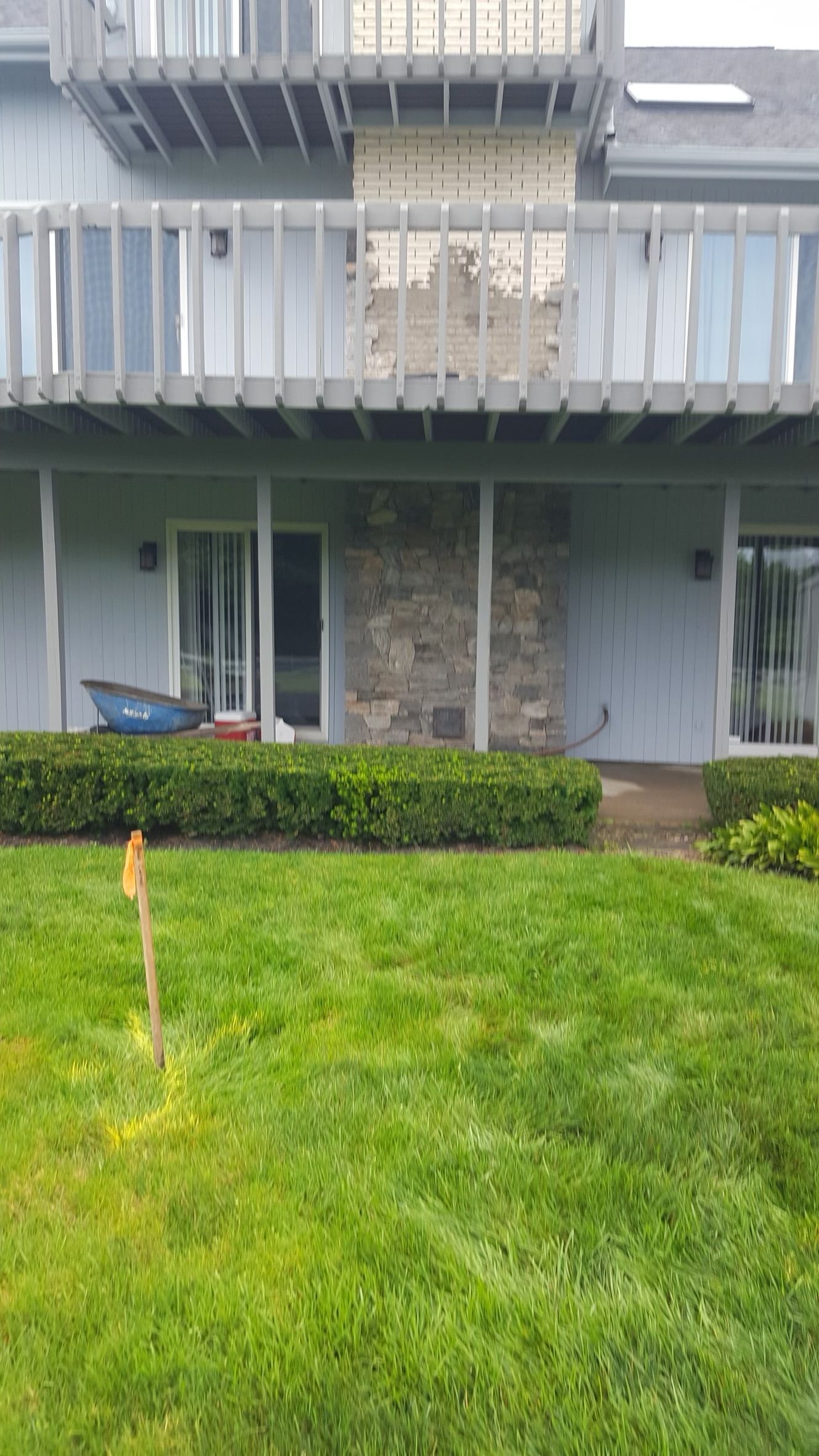 a large house with a lush green lawn in front of it