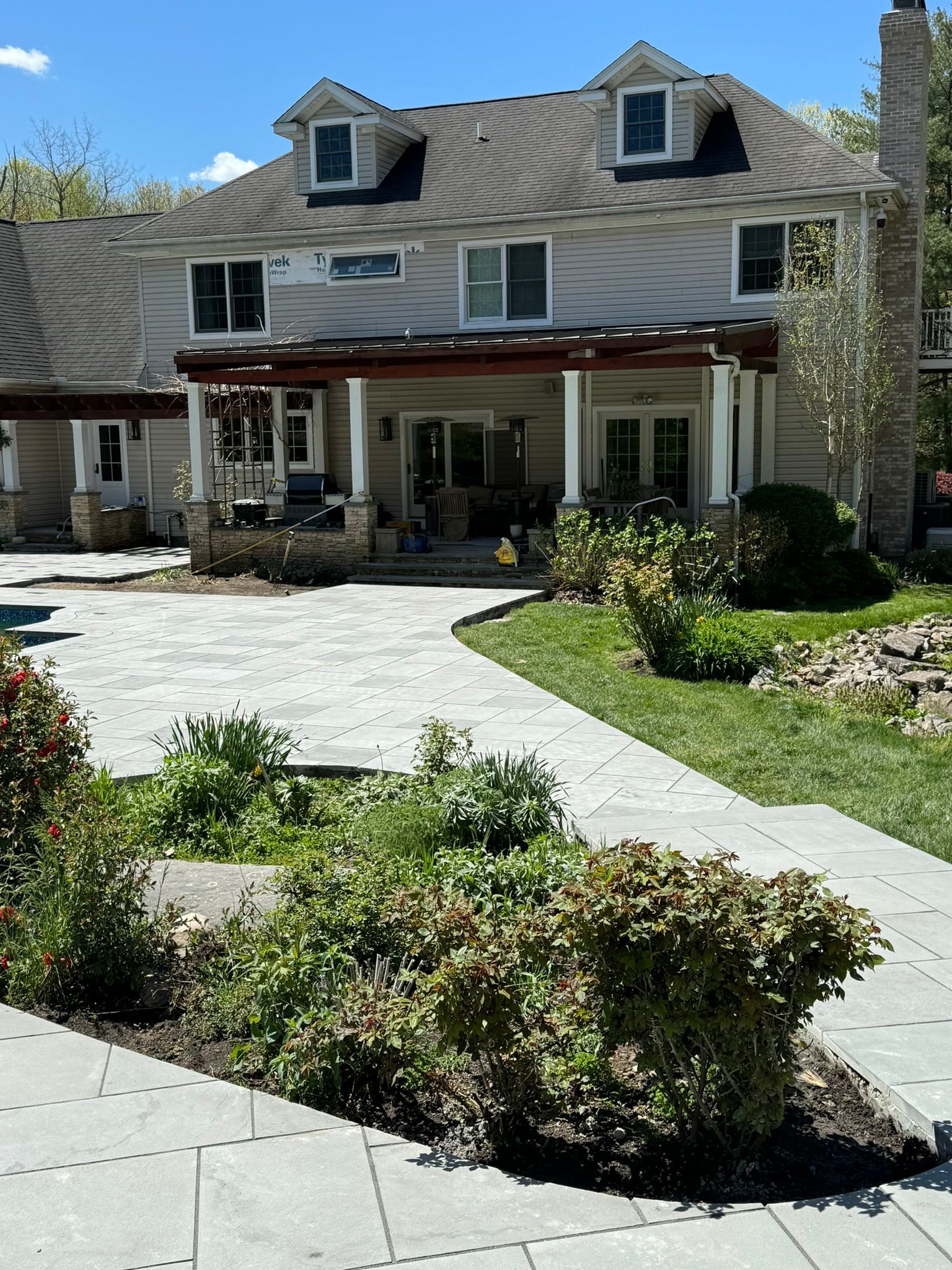A large white house with a walkway leading to it