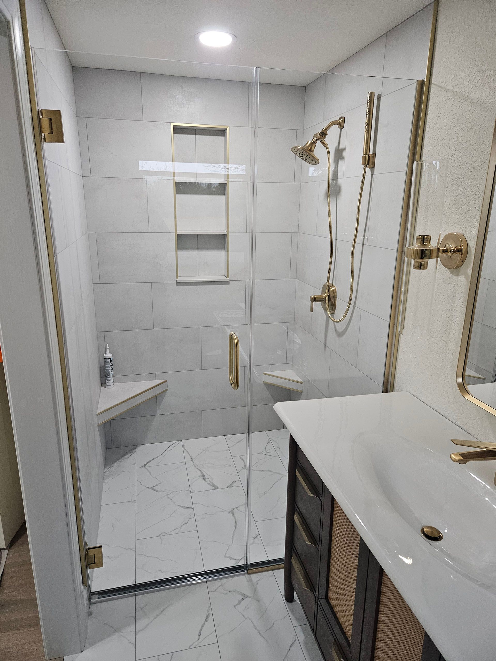 Door and panel - A bathroom with a sink, shower, and mirror.