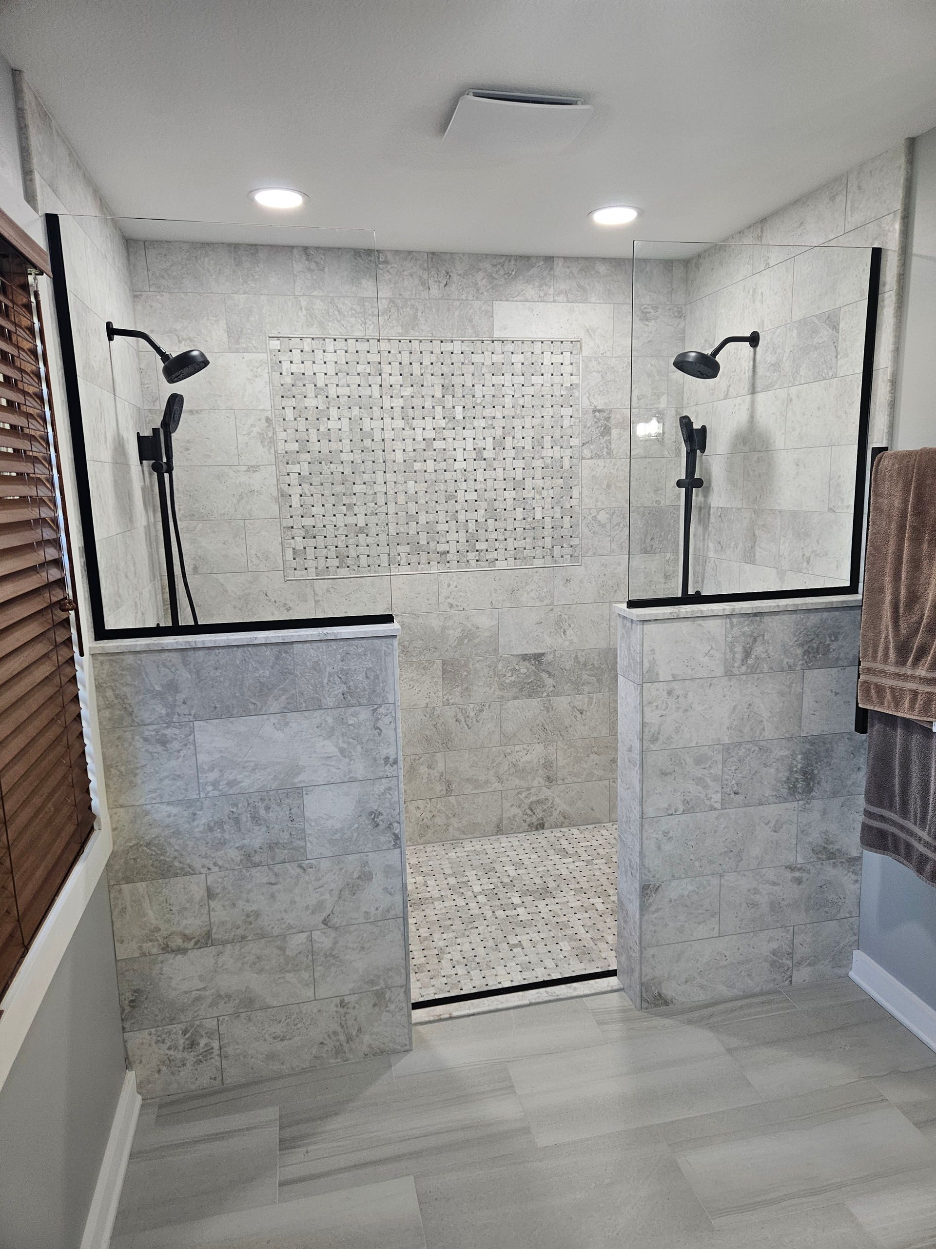 Just Panel (No Door) - A bathroom with a walk-in shower and two shower heads.