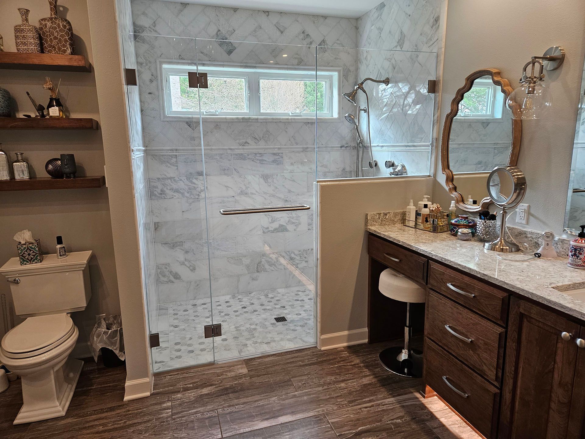 Multiple panels - A bathroom with a toilet, sink, mirror, and walk-in shower.