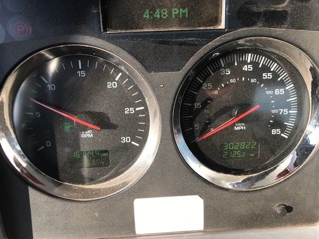 A dashboard with a speedometer and a fuel gauge