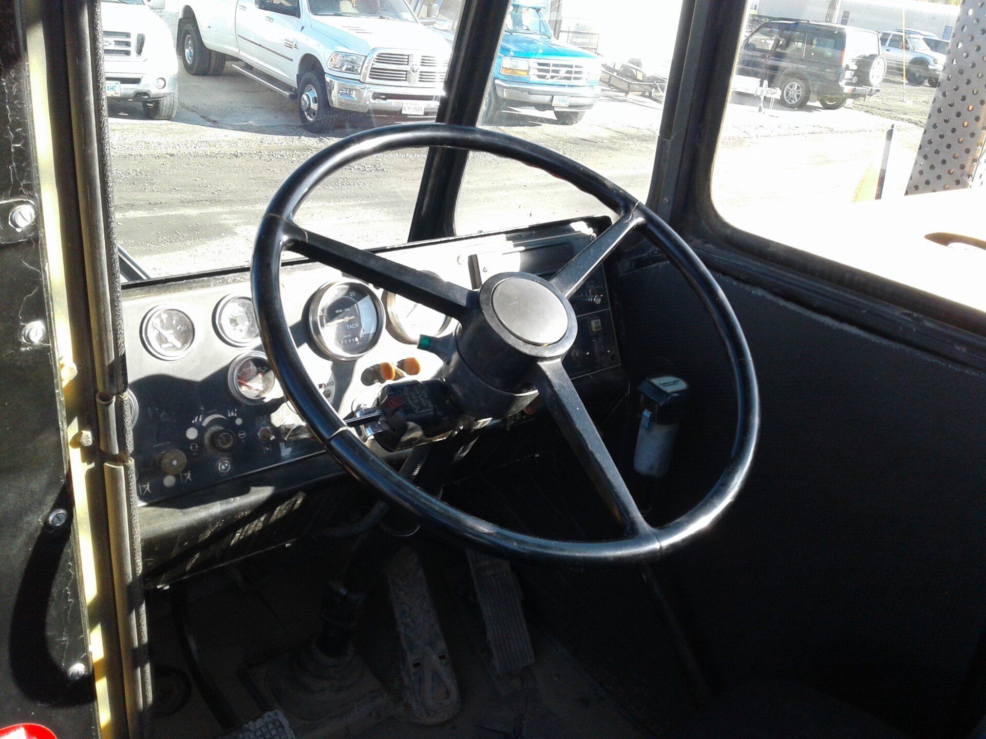 A close up of a steering wheel in a car