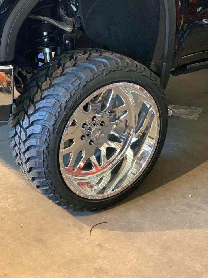 A close up of a truck wheel with a tire on it.
