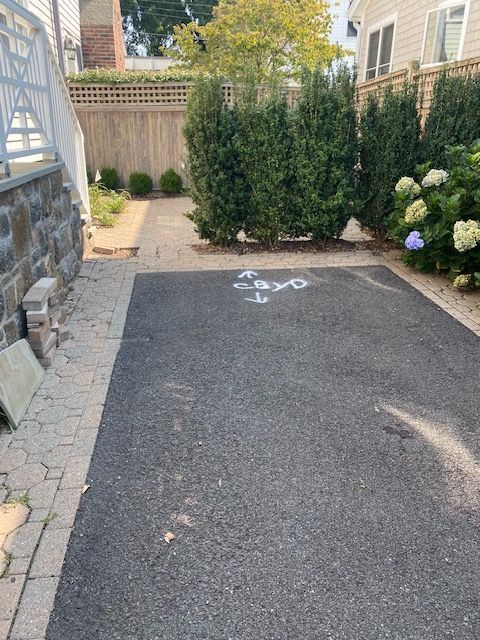A bicycle is painted on the side of the road