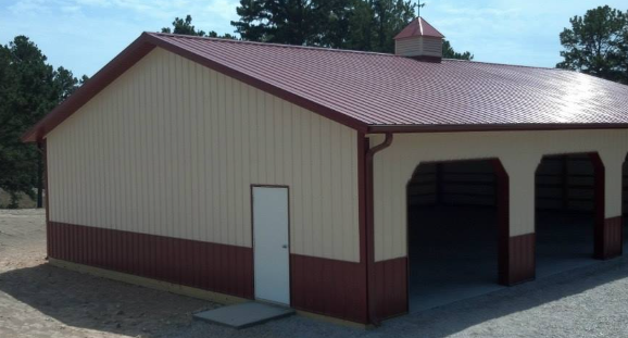 A building with a red roof and a white door