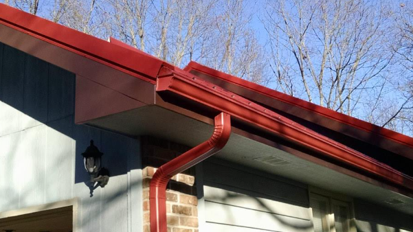 A house with a red gutter and a red roof