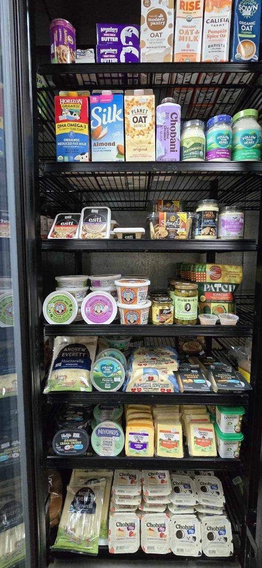 A refrigerator filled with a variety of dairy products.
