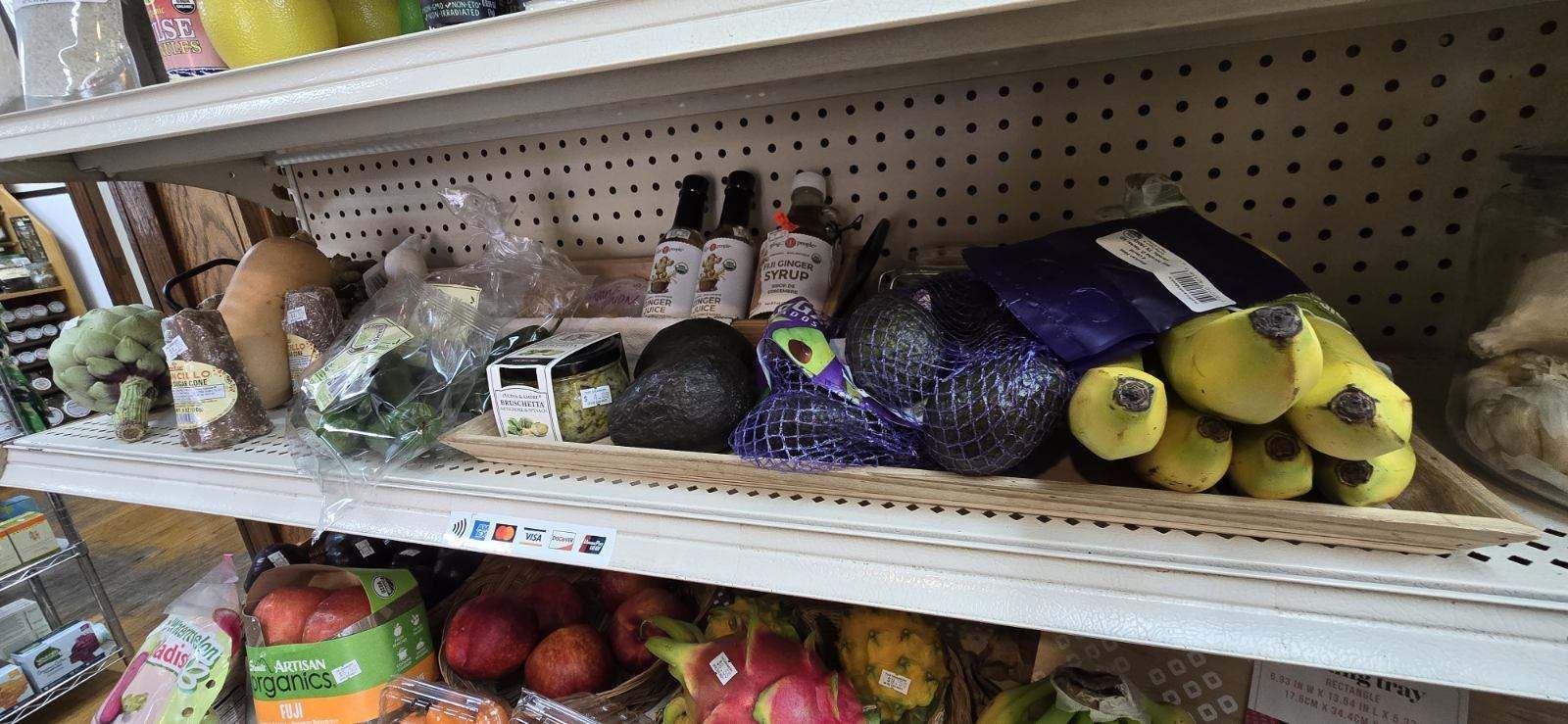A fruits and vegetables displayed on a grocery store shelves