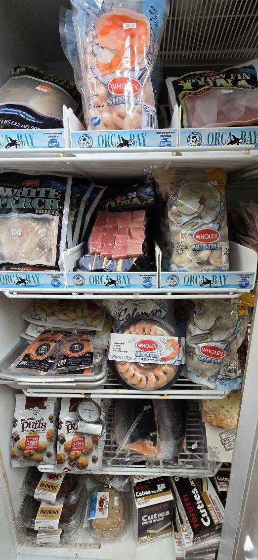 The inside of a refrigerator filled with lots of food.