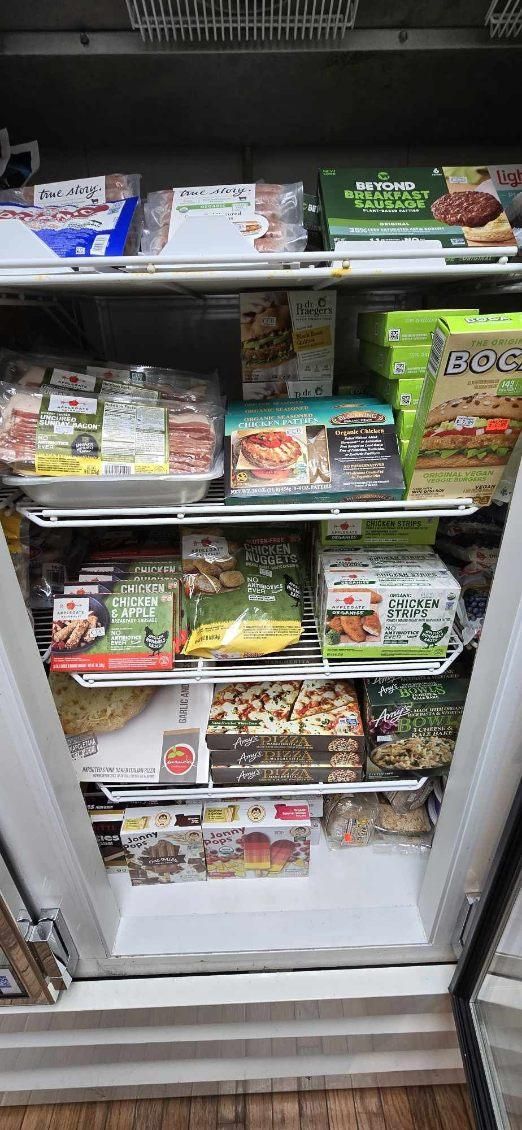 A refrigerator filled with a variety of frozen foods.