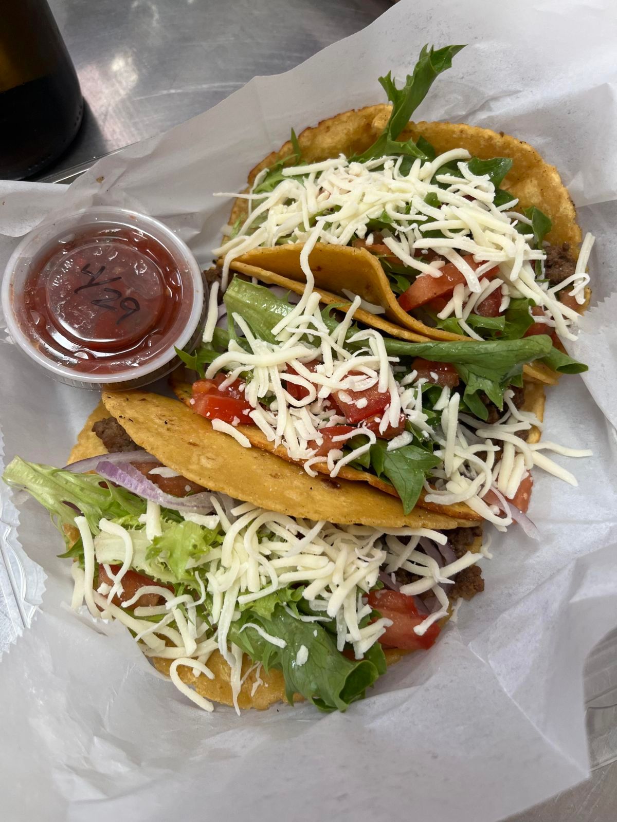 Tacos with lettuce, tomatoes, and cheese
