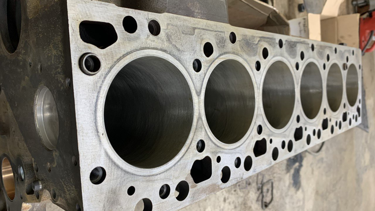 A close up of a cylinder block of a car engine.