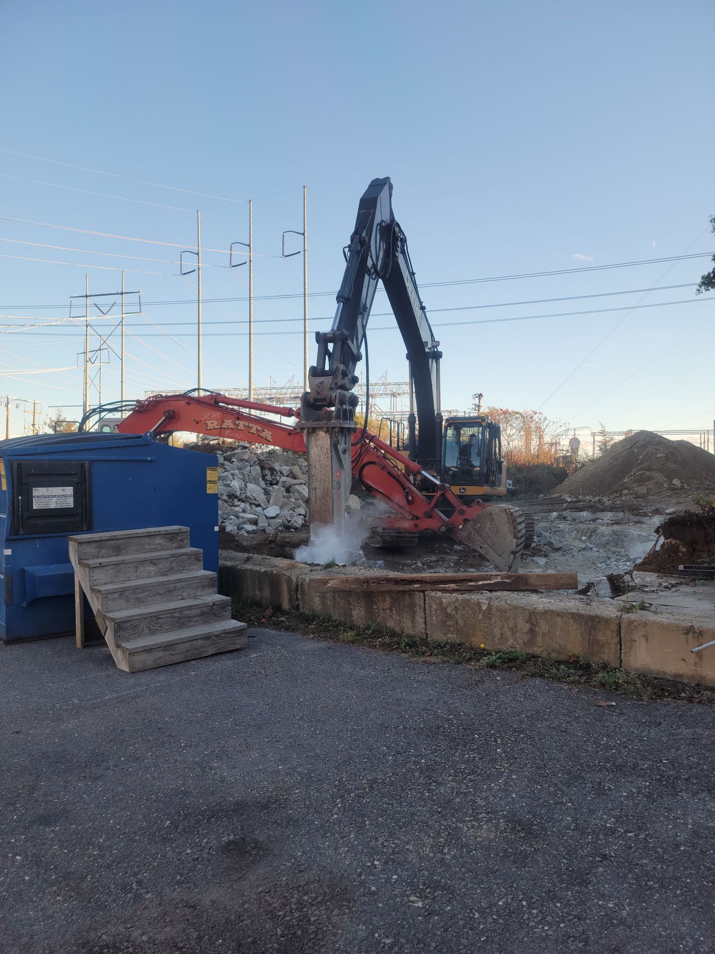A large excavator is working on a construction site.