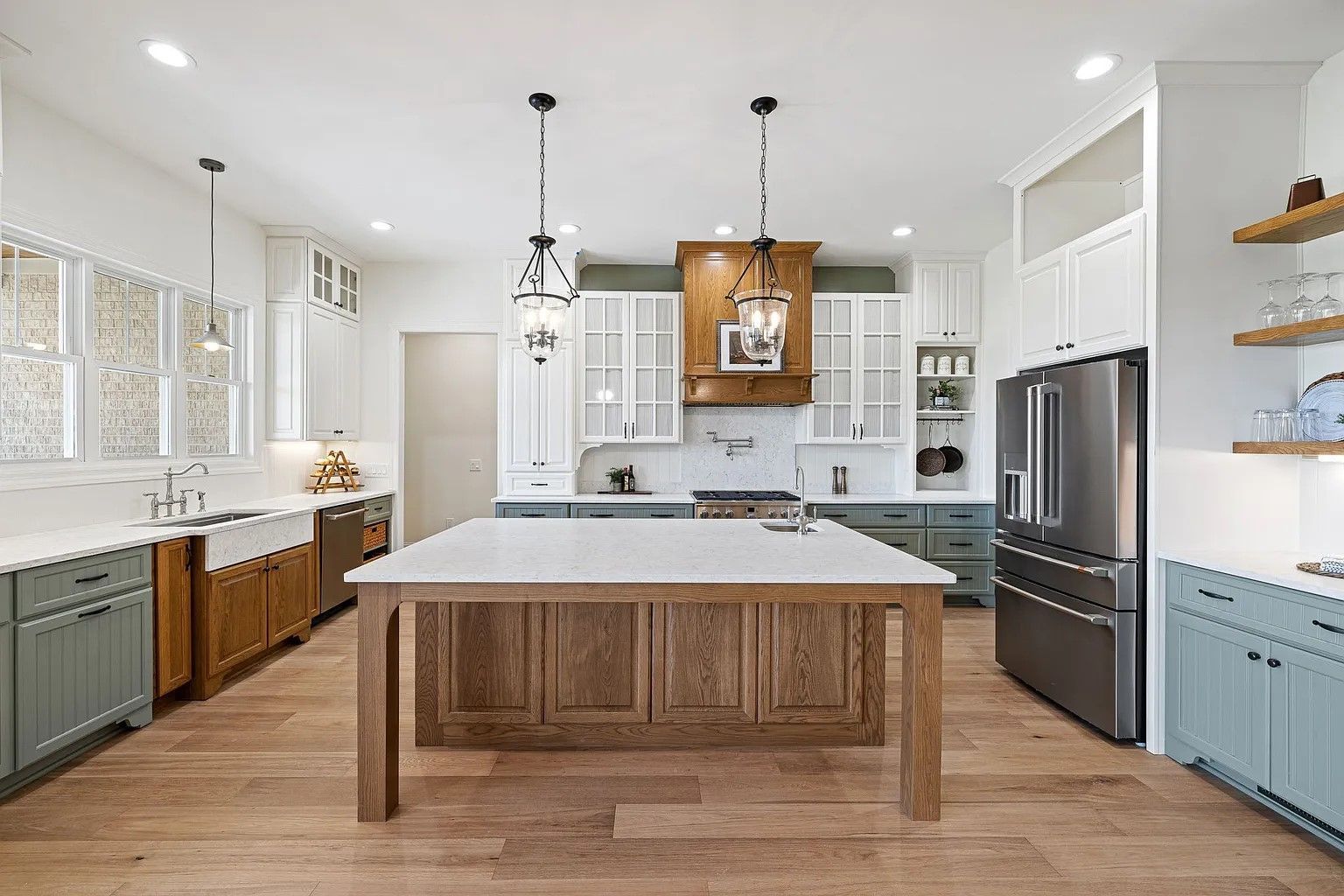 There is a large island in the middle of the kitchen.
