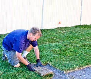 Man installing turf