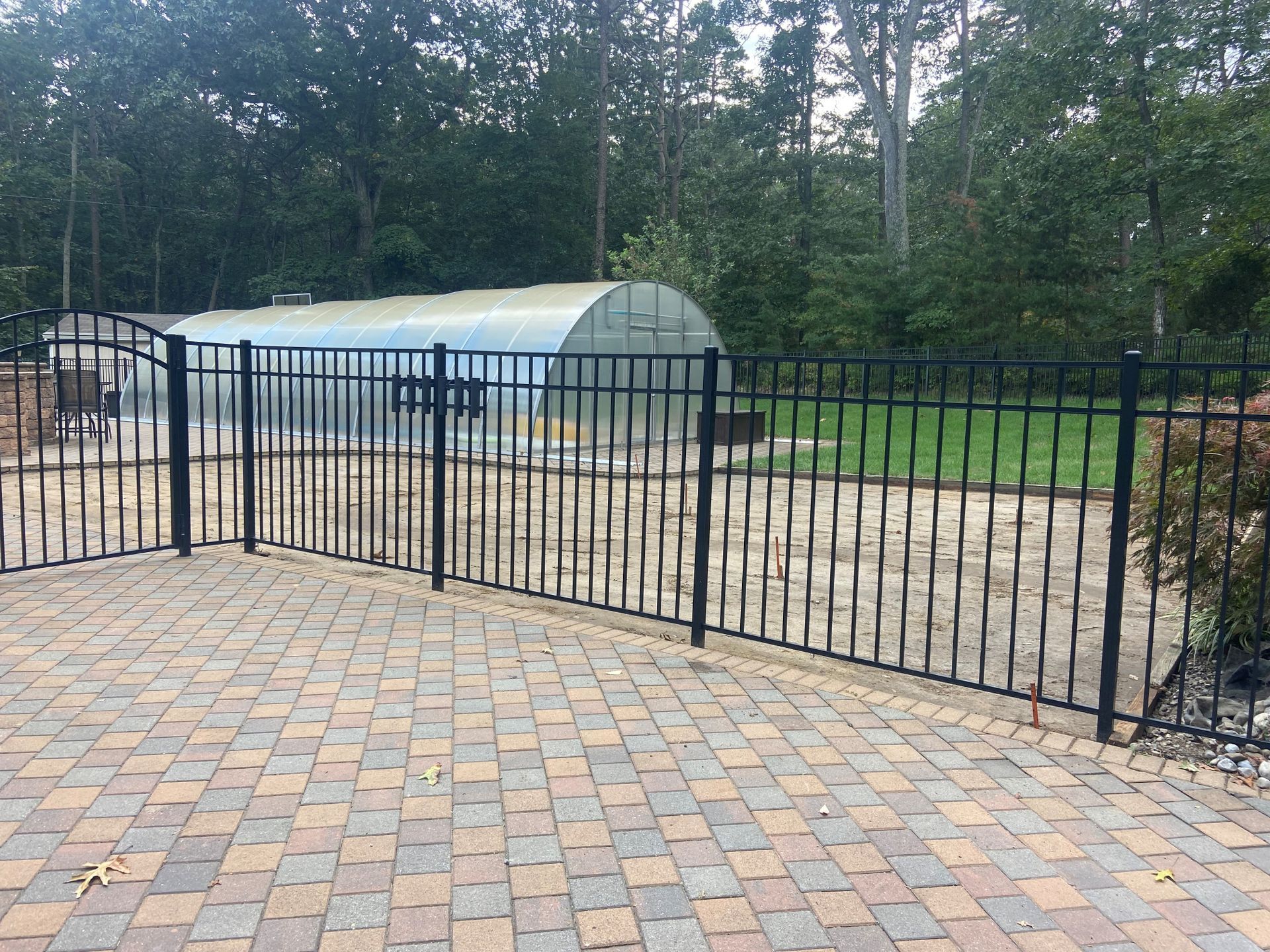 Stones-walkway-black-fence