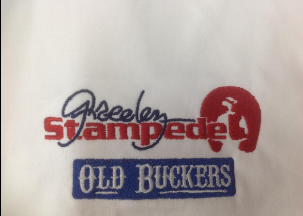 A white shirt with old buckers embroidered on it