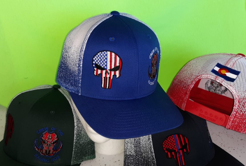 A blue hat with an american flag skull on it