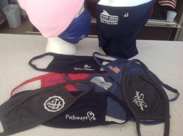 A bunch of face masks with one that says pathways on it