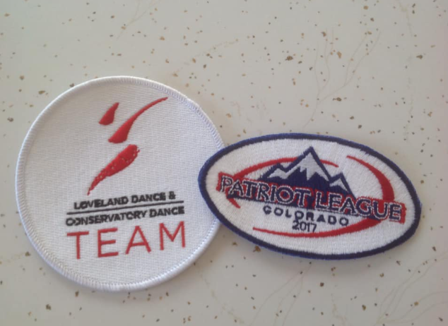Two patches one of which says patriot league on it