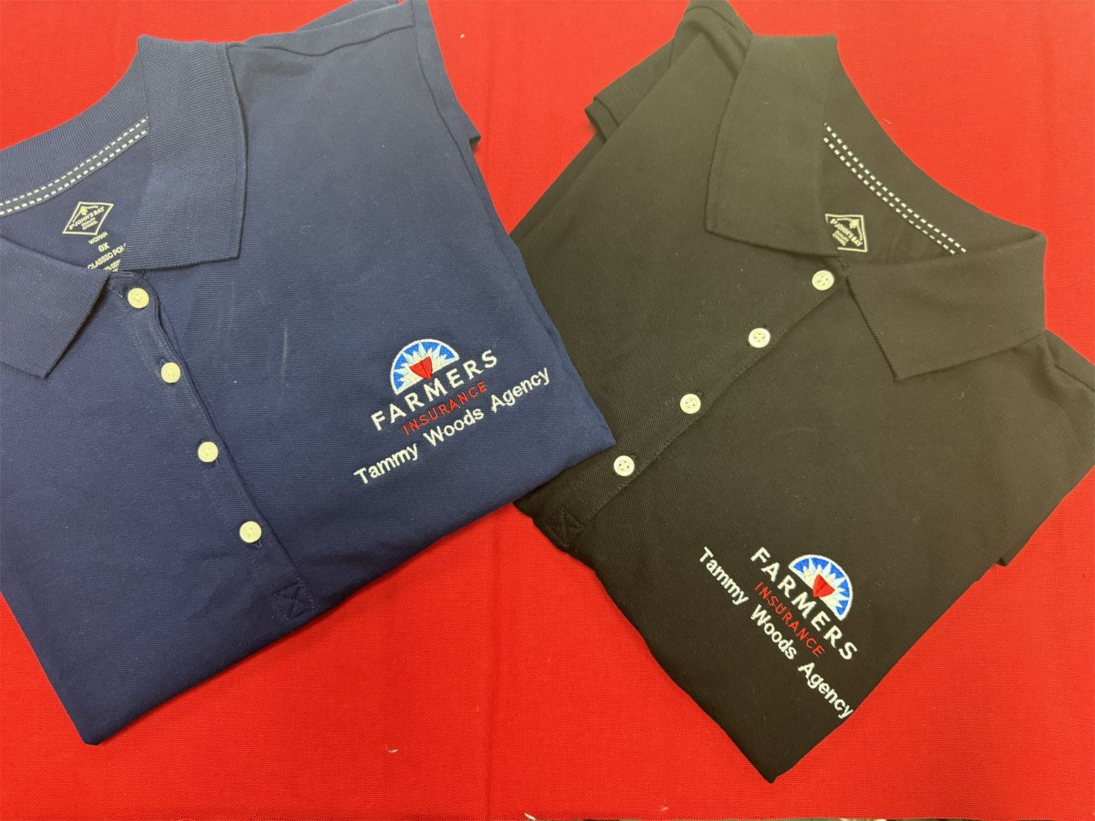 Two polo shirts with partners written on them