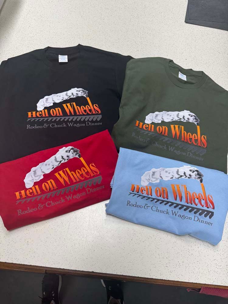 T-shirts, black, green, red, and blue, with a Hell on Wheels logo in various colors.