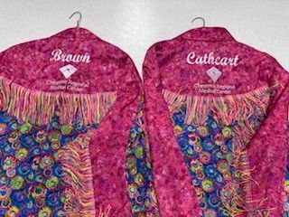 Pink fringed rodeo shirts.