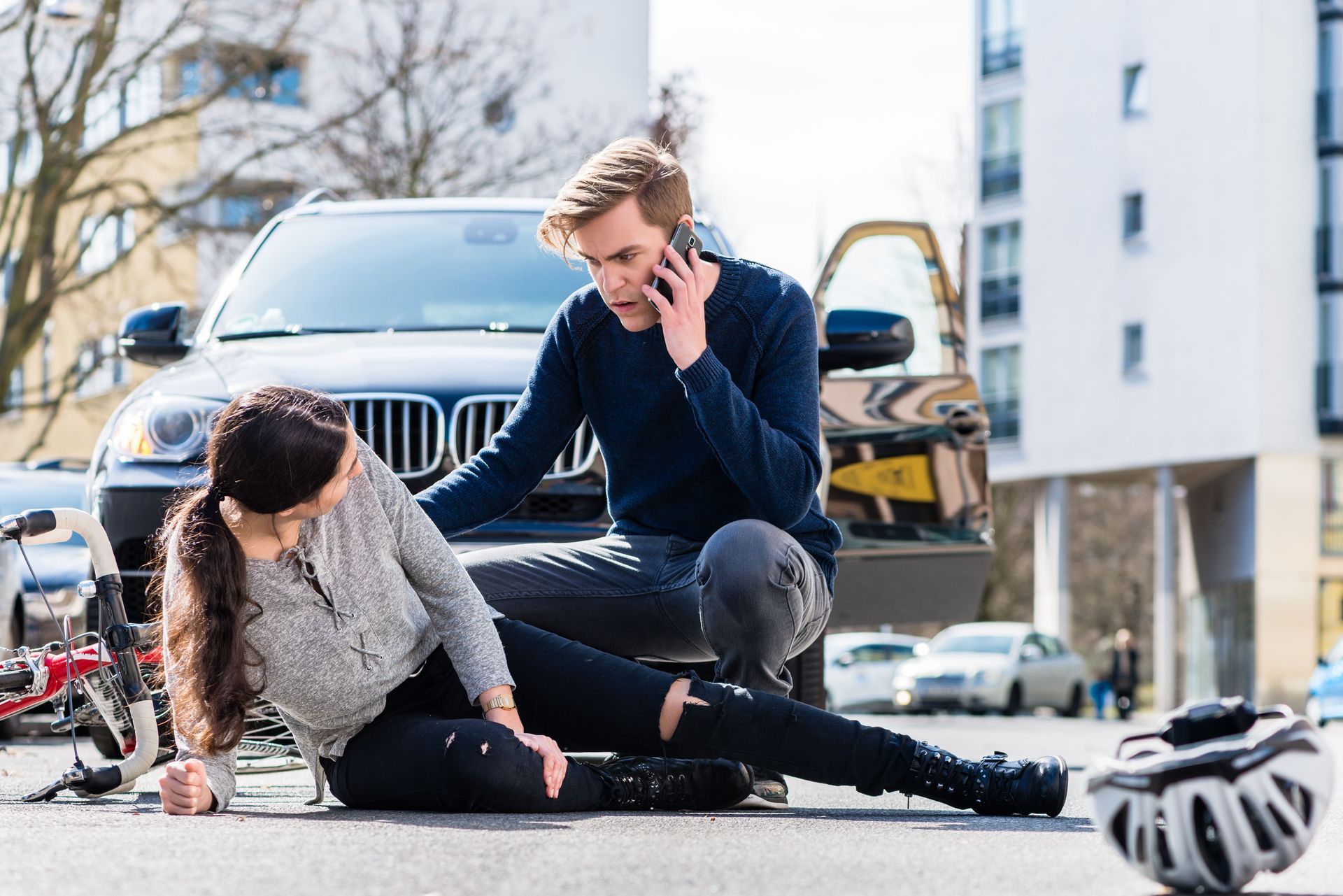 A man calling for chiropractic services for a woman's hurt leg.