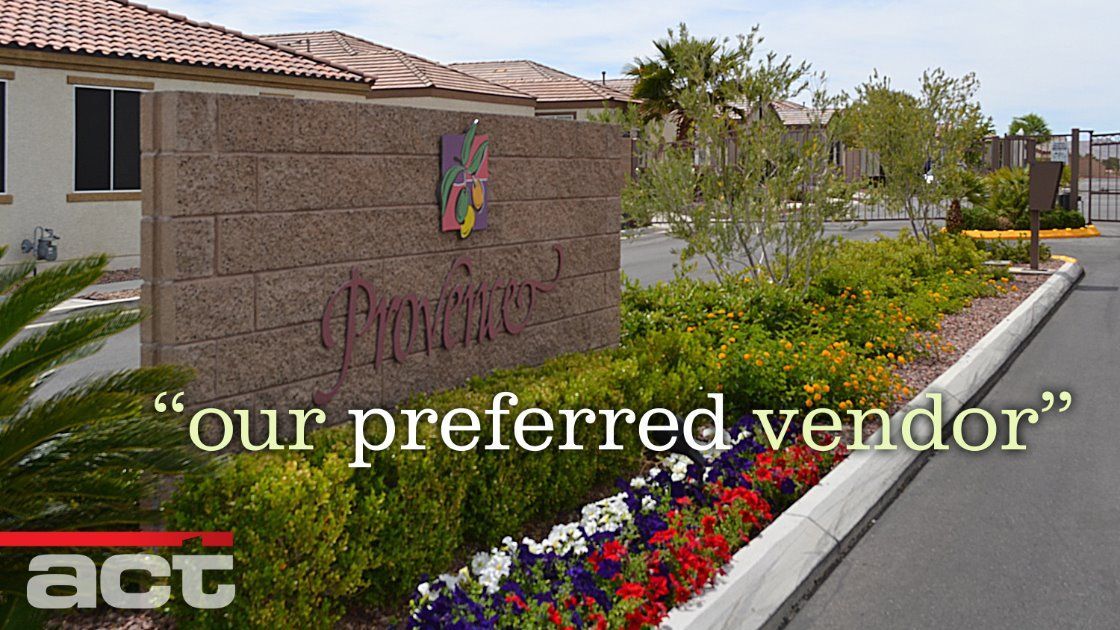 Sign for community with landscaping and text overlay 