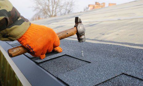 Repairing bitumen roof shingles