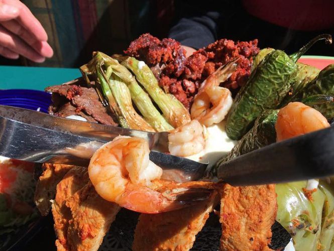 Mexican platter with shrimp, chorizo, peppers, and grilled vegetables