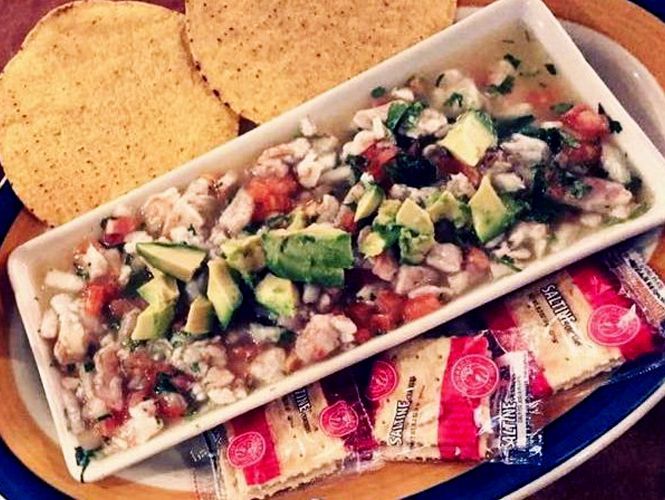 Ceviche with avocado, tomatoes, and cilantro