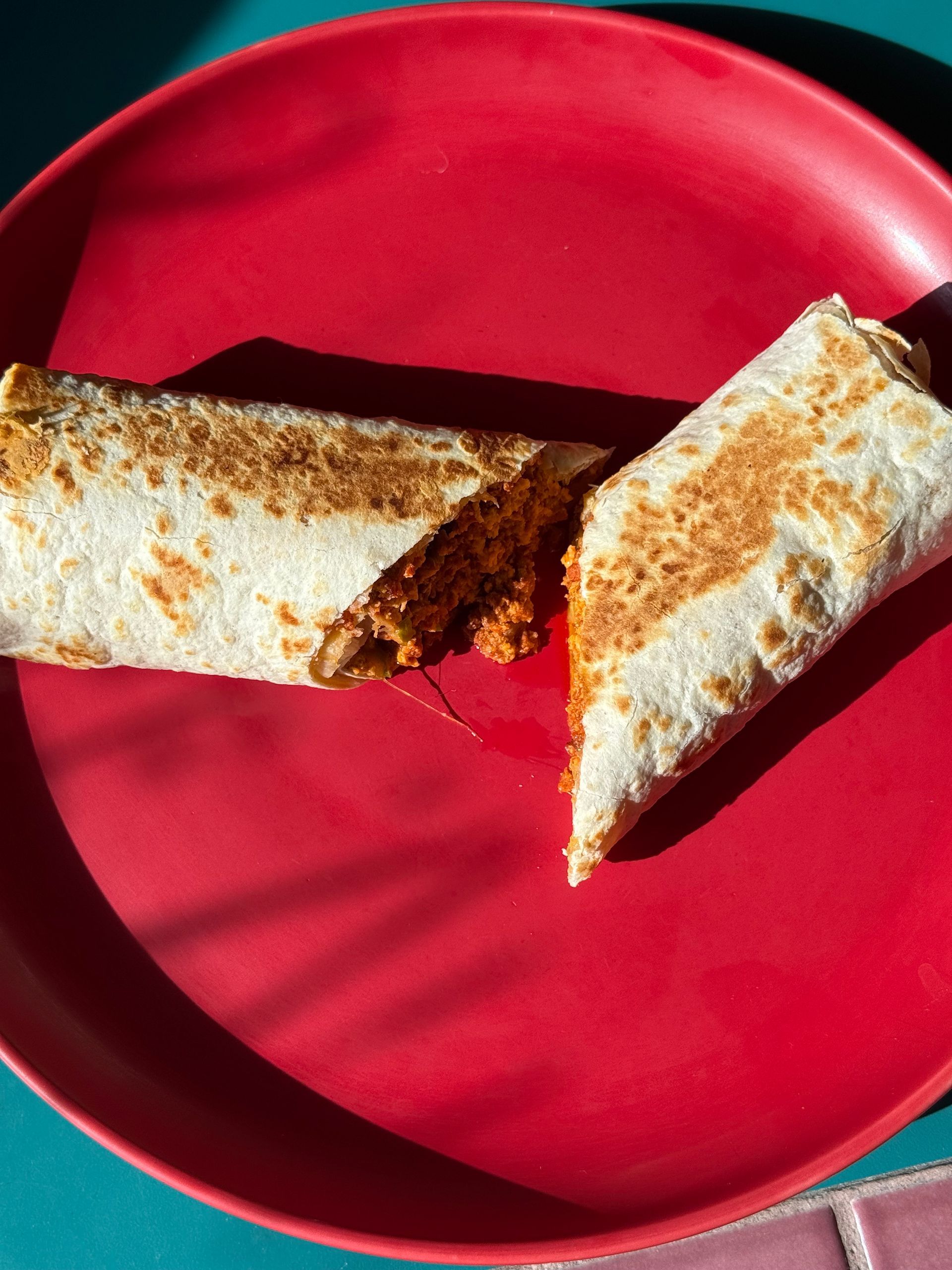 Tacos, enchiladas, rice, beans, guacamole, sour cream, cheese, and salsa