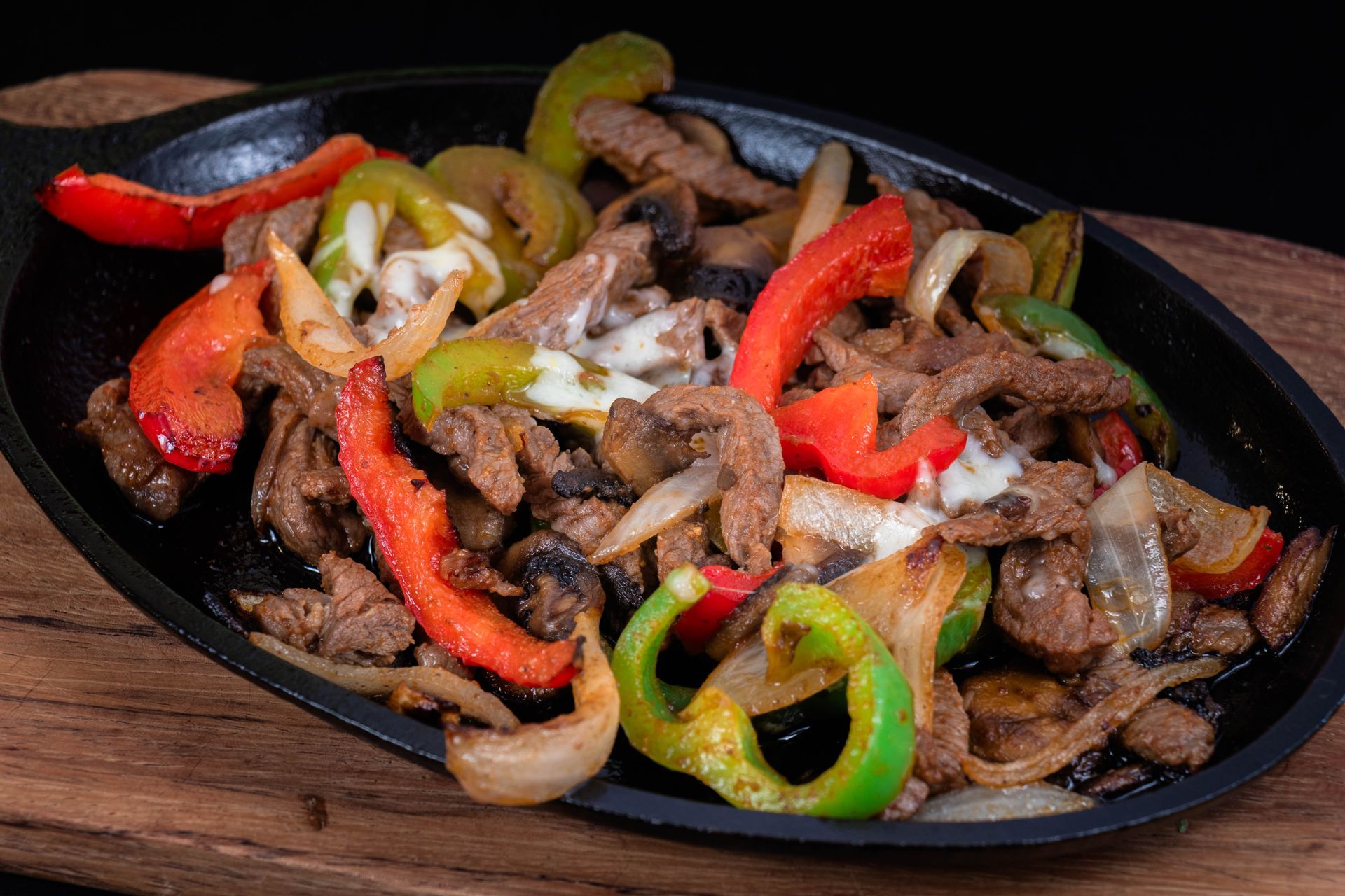 Mexican platter with shrimp, chorizo, peppers, and grilled vegetables