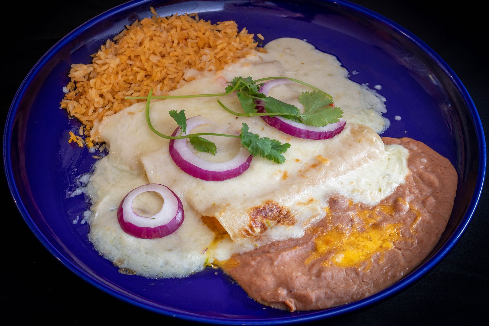 Tacos and enchiladas on plates