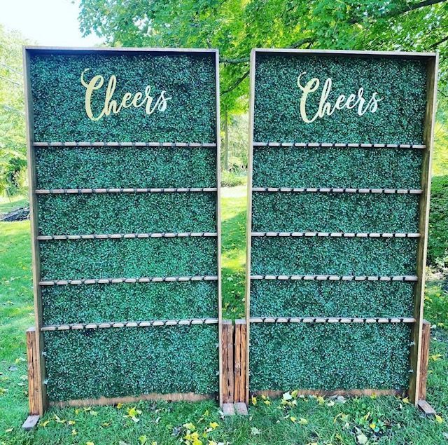 Two green boxwood walls with 