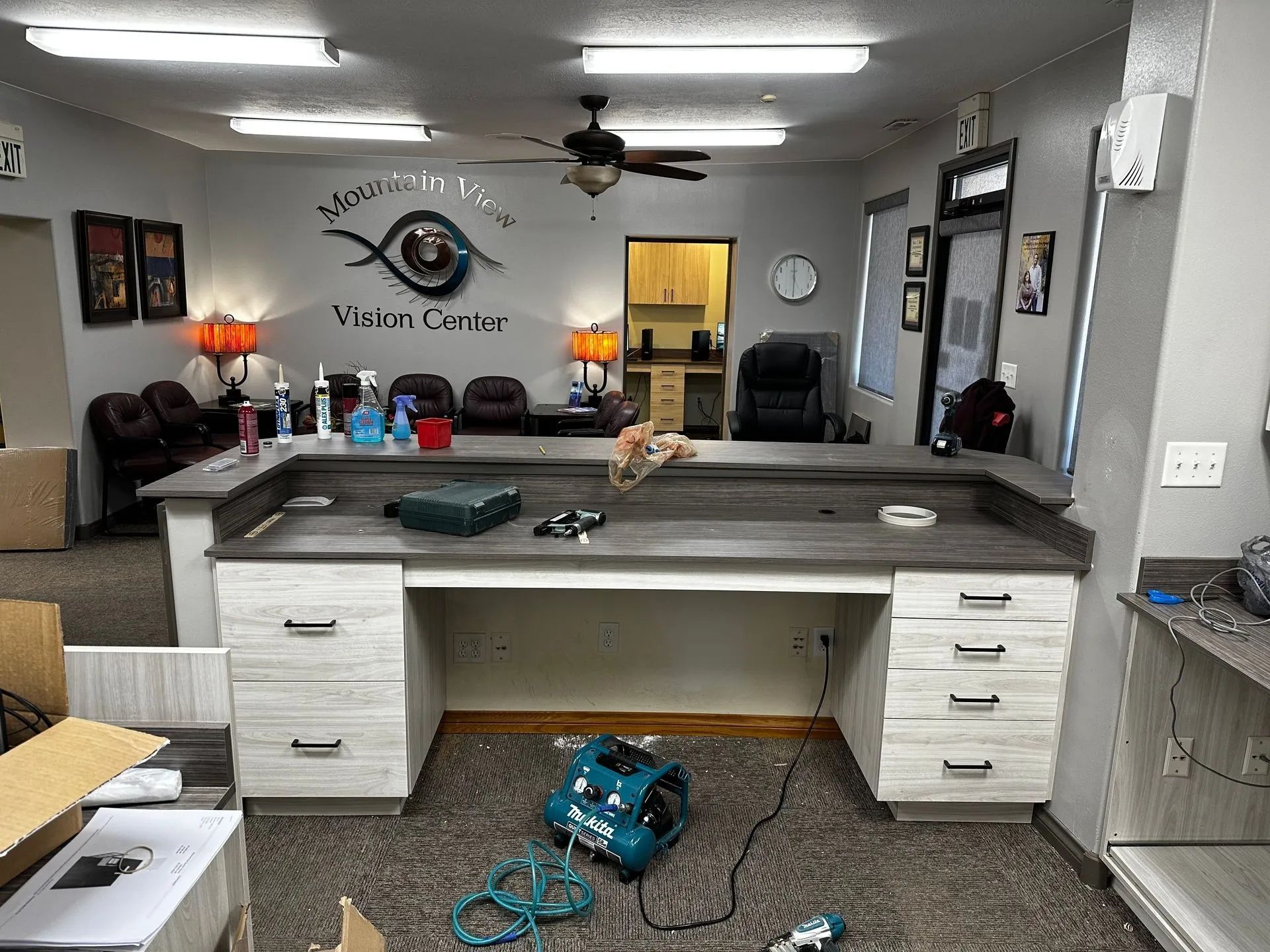 Interior of a senior center with a large desk, tools, and supplies.