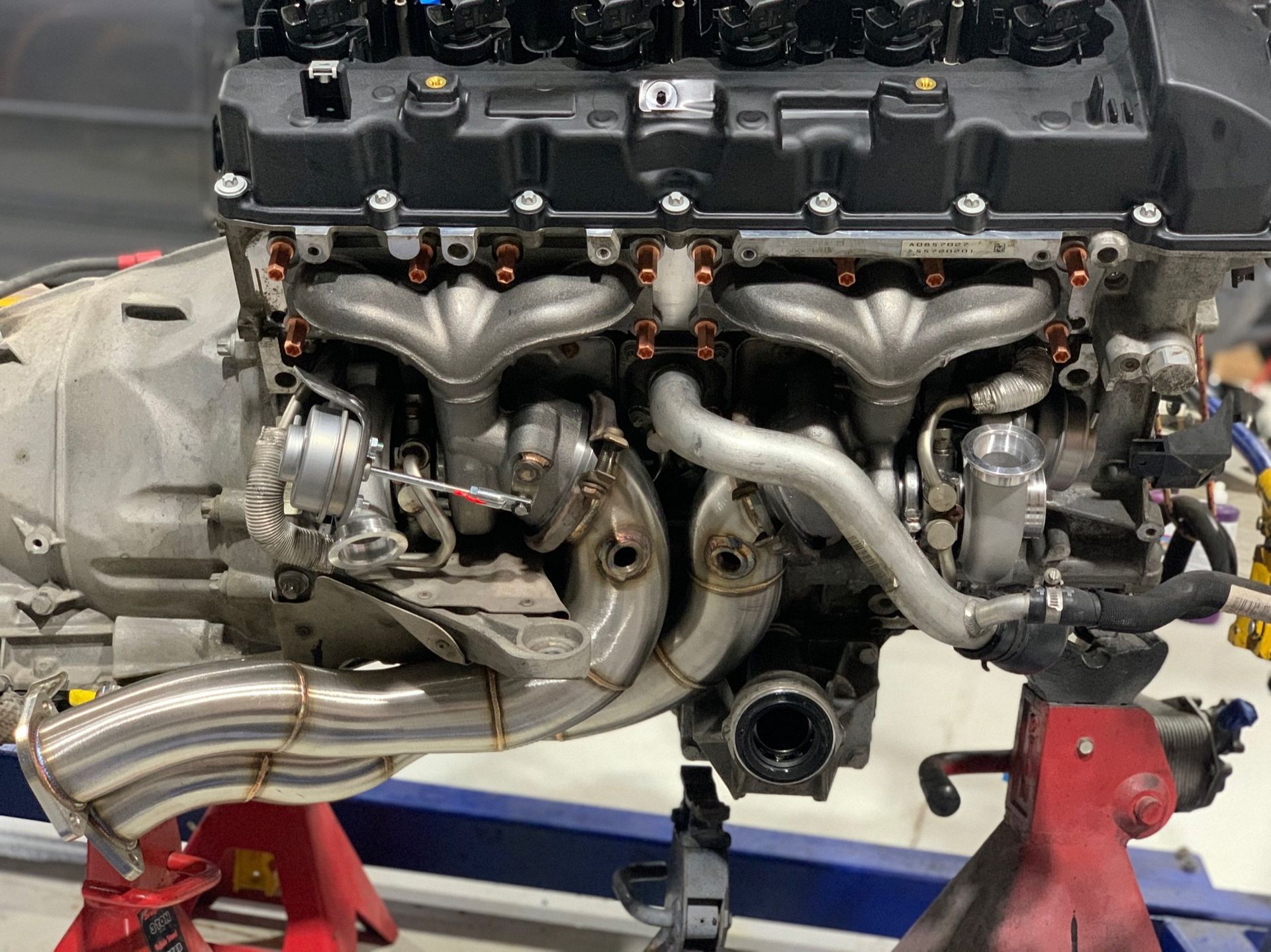 a close up of a car engine on a stand 