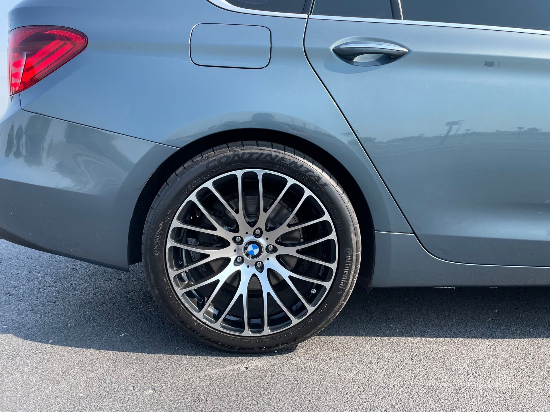 a close up of a car wheel on a road