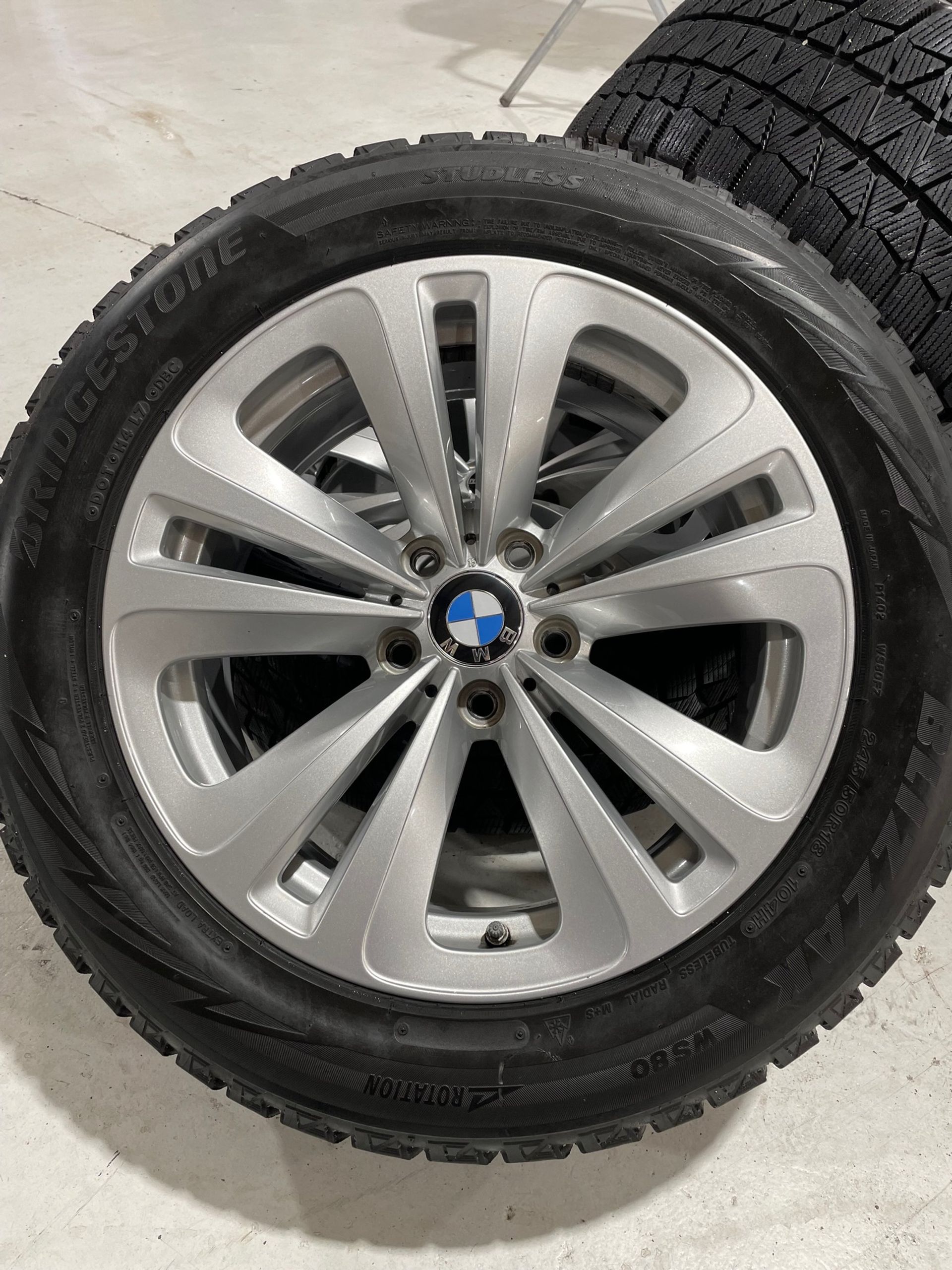 a close up of a bmw wheel with a tire on it