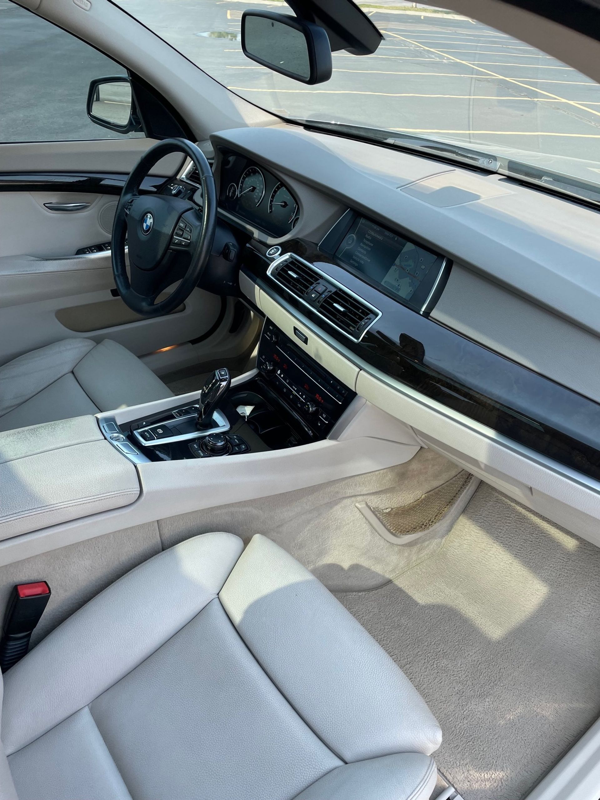 the interior of a car with a steering wheel and dashboard