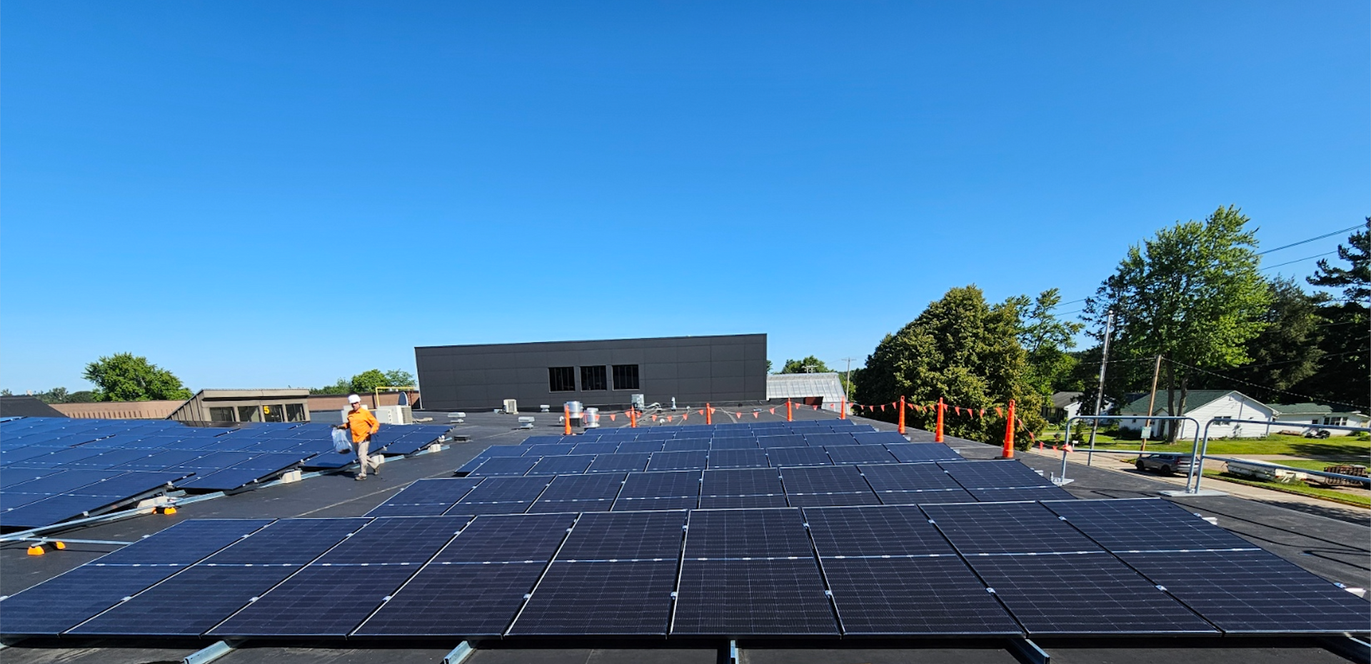 One of the arrays being installed atop Tomorrow River Schools, August 2025.