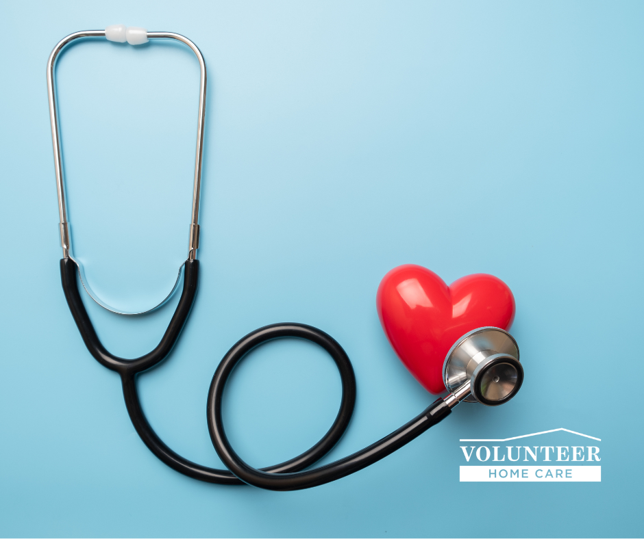 A stethoscope is attached to a red heart on a blue background.