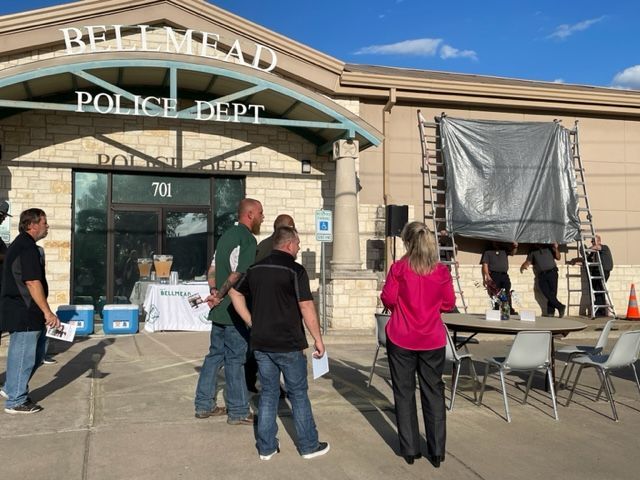People in front of police department